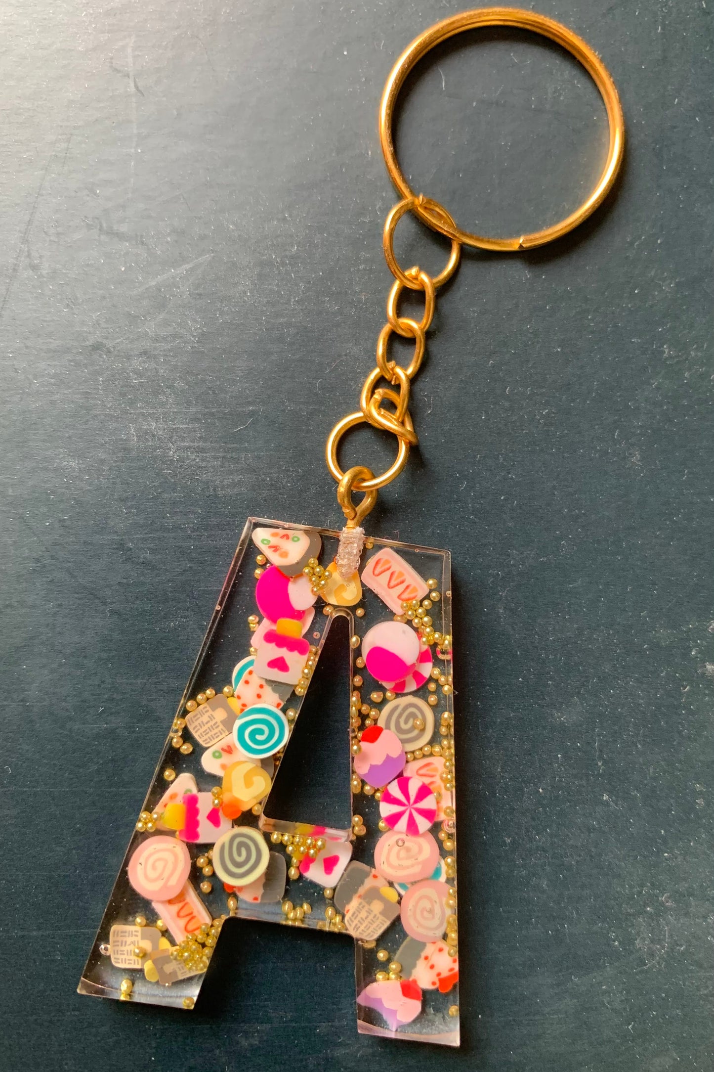Initial made of resin and polymer clay cake slices set and made into a keyring with gold or silver ring