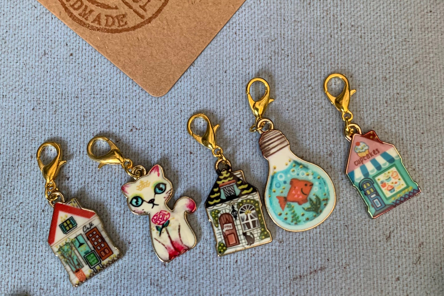 Pink and blue cat, fish and house stitch markers with lobster clasp