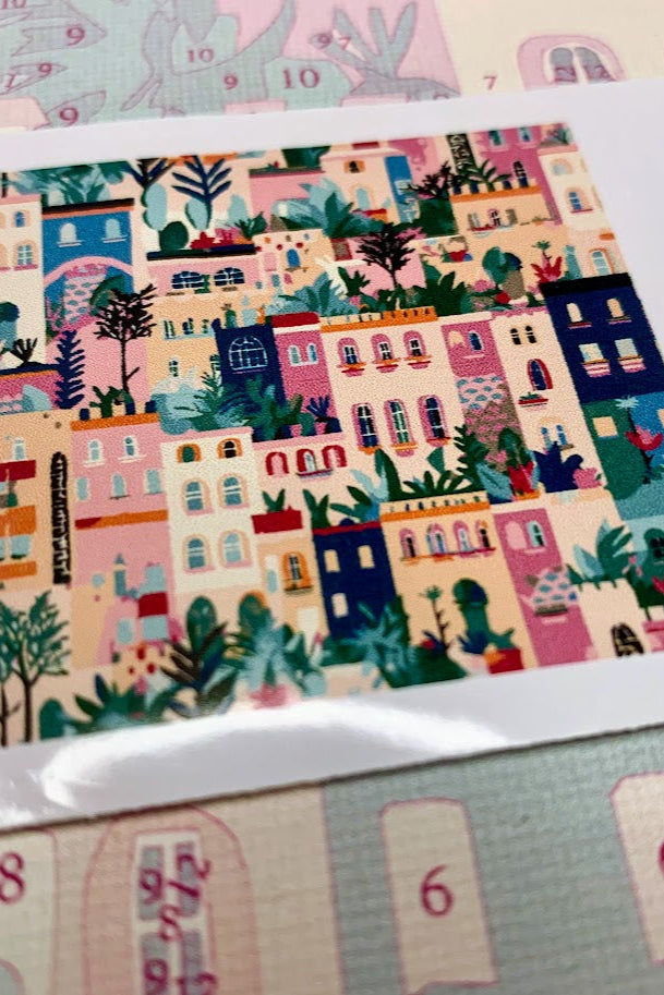 A canvas with numbers for painting featuring a village scene