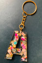 Initial made of resin and polymer clay cake slices set and made into a keyring with gold or silver ring
